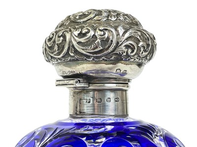 Lot 487 - A Victorian silver mounted blue overlay glass scent bottle.