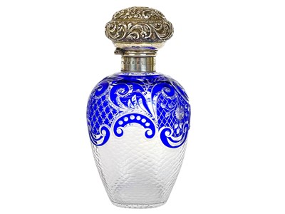 Lot 487 - A Victorian silver mounted blue overlay glass scent bottle.