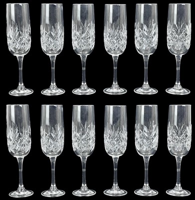 Lot 454 - A set of twelve cut glass champagne flutes.