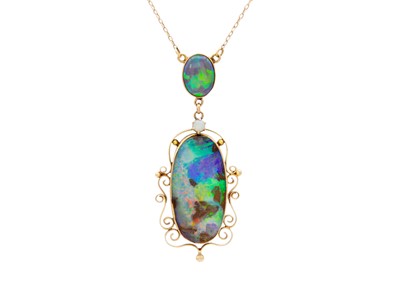 Lot 32 - A good 9k gold black boulder opal pendant necklace.