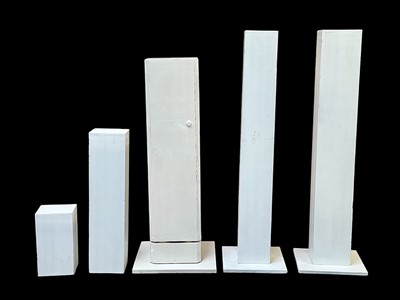 Lot 1054 - A pair of white painted display plinths.