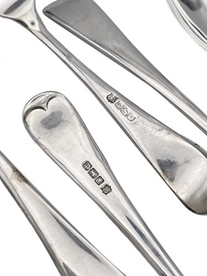 Lot 31 - A set of six OE pattern table forks and five table spoons by Cooper Brothers & Sons Ltd.