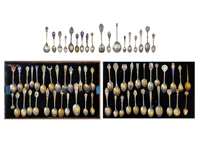 Lot 202 - An impressive collection of silver and enameled Canadian and British souvenir teaspoons.