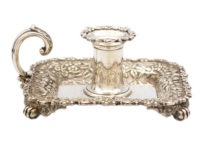 Lot 239 - TIFFANY & CO - A silver-plated heavily cast chamber stick.