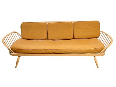 Lot 327 - An Ercol blond beech and elm studio couch or day bed.