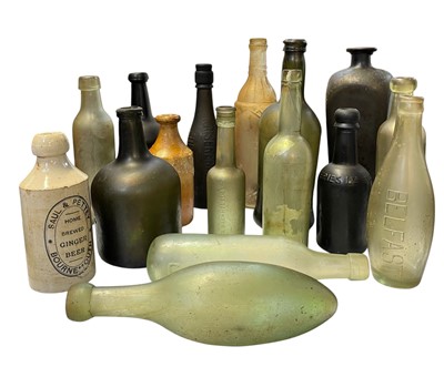 Lot 38 - 15 assorted glass bottles and two stoneware jars.