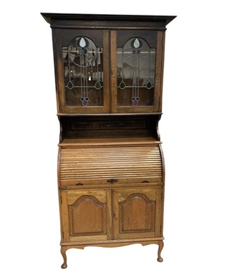 Lot 15 - A Bureau Bookcase. In Oak, and with a Roll Top...