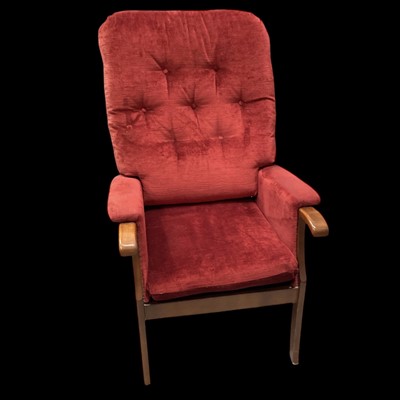 Lot 91 - A fireside armchair in deep red.