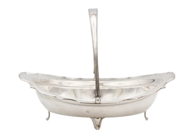 Lot 84 - A George V silver swing handled cake basket by James Dixon & Sons Ltd.