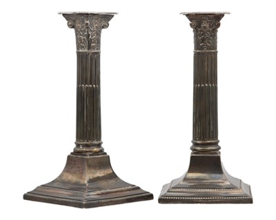 Lot 94 - A pair of George V silver Corinthian column weighted candlesticks by Lee & Wigfull.