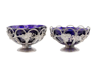 Lot 93 - A pair of Victorian silver sweetmeat baskets with blue glass liners by Joseph & Edward Bradbury.