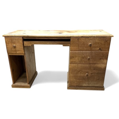 Lot 33 - A pine desk with a pull-out keyboard drawer,...