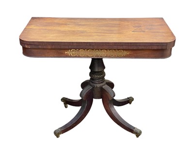 Lot 673 - A Regency rosewood and brass inlaid fold-top card table.