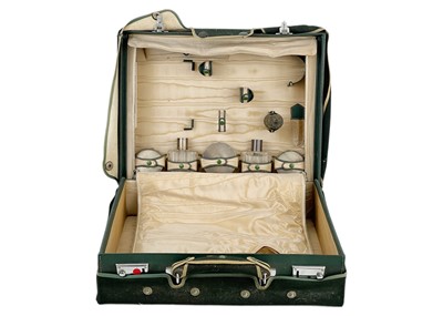 Lot 104 - A partially filled vanity case.