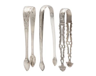 Lot 182 - A selection of three antique silver sugar tongs.