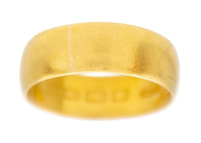 Lot 22 - A 22k yellow gold wide band ring.