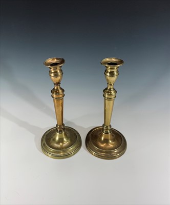 Lot 163 - A pair of Georgian brass candlesticks. Height...