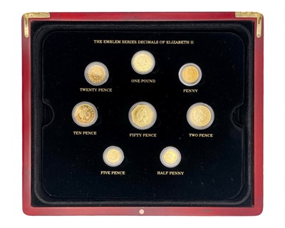 Lot 43 - A London Mint 'Golden Edition' part coin set within hinged case with certificates.