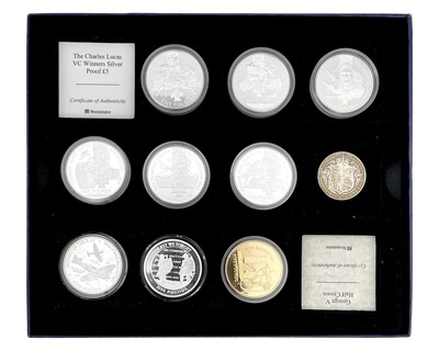 Lot 42 - A collection of nine silver proof £5 coins and a George V 1915 half crown.