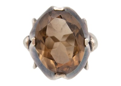 Lot 223 - A large smokey quartz in chunky silver frame cocktail ring