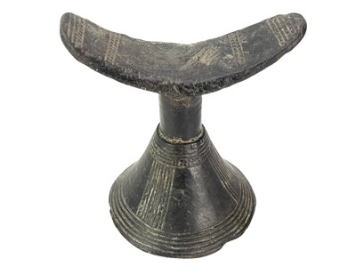 Lot 72 - A carved wood tribal headrest.