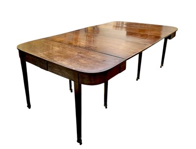 Lot 436 - A late George III mahogany concertina action dining table.