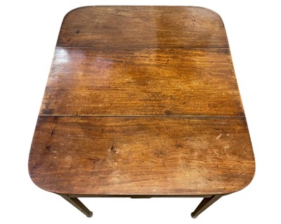 Lot 436 - A late George III mahogany concertina action dining table.