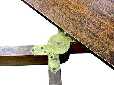 Lot 436 - A late George III mahogany concertina action dining table.