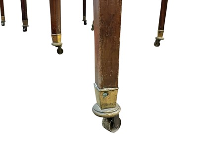 Lot 436 - A late George III mahogany concertina action dining table.