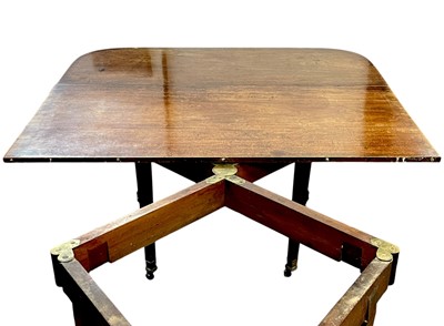 Lot 436 - A late George III mahogany concertina action dining table.