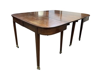 Lot 436 - A late George III mahogany concertina action dining table.