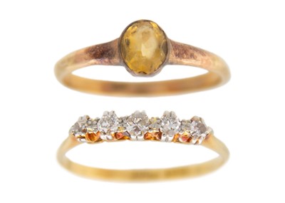 Lot 79 - An 18k gold five dainty diamond ring, and a 9k gold citrine solitaire ring.