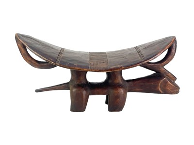 Lot 57 - An African hardwood zoomorphic stool.