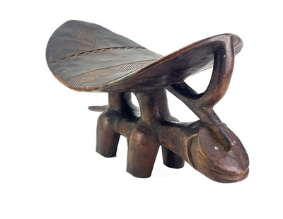 Lot 57 - An African hardwood zoomorphic stool.