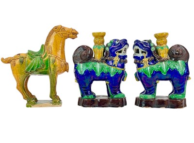 Lot 183 - A pair of Chinese glazed Dogs of Fo incense holders.