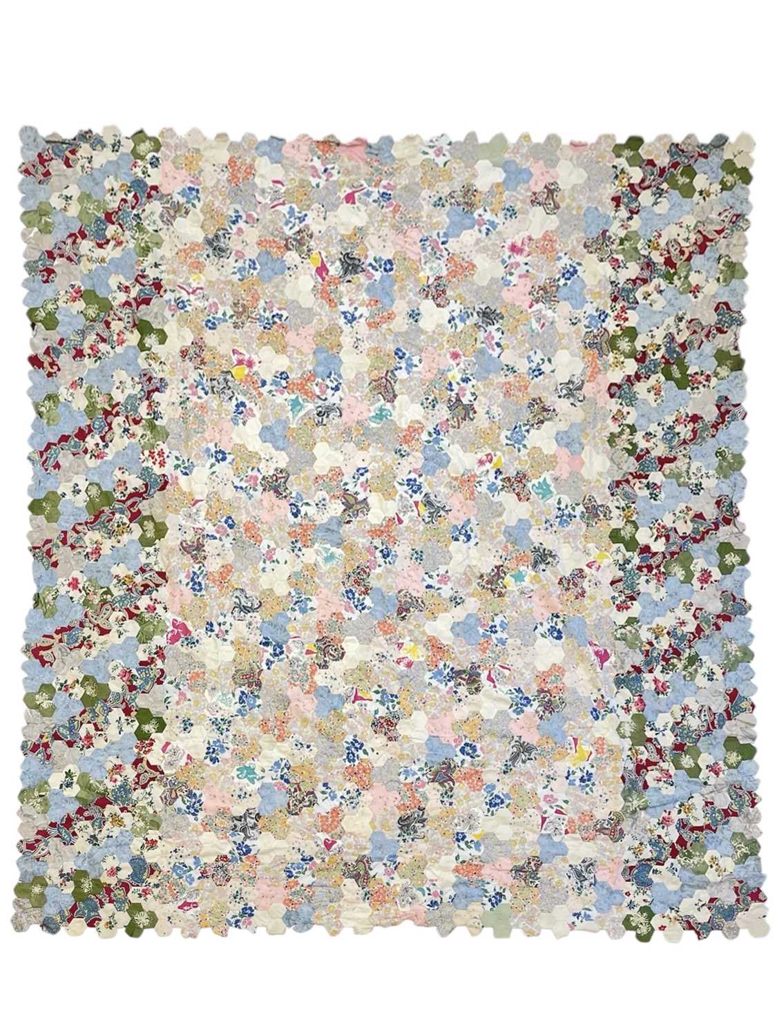 Lot 291 - A hand-sewn patchwork quilt.