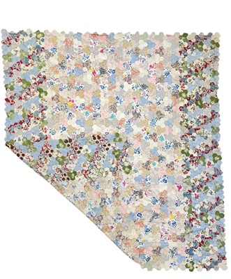 Lot 291 - A hand-sewn patchwork quilt.