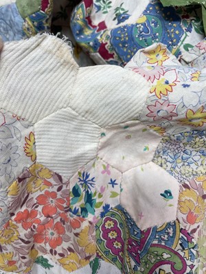 Lot 291 - A hand-sewn patchwork quilt.