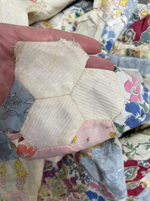 Lot 291 - A hand-sewn patchwork quilt.