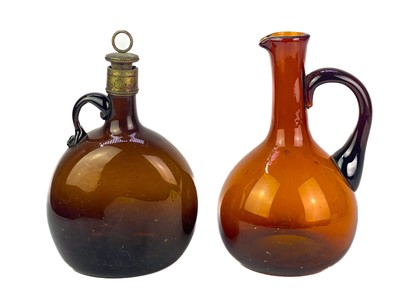 Lot 204 - A Victorian brown glass carafe and decanter.