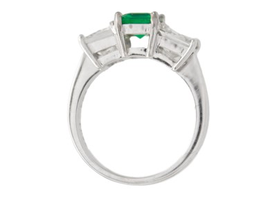 Lot 3 - An impressive emerald and diamond three-stone ring