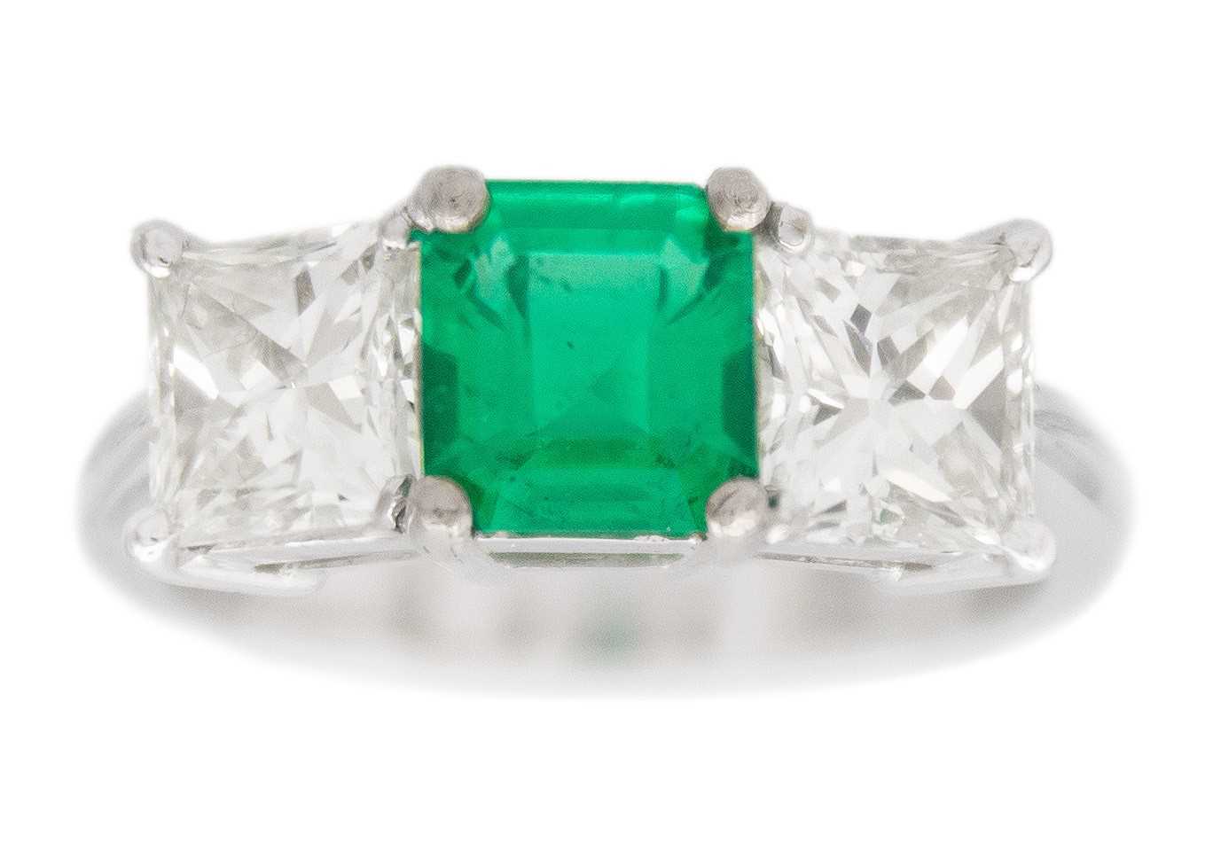 Lot 3 - An impressive emerald and diamond three-stone ring