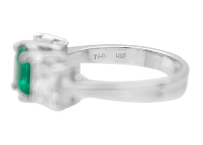 Lot 3 - An impressive emerald and diamond three-stone ring