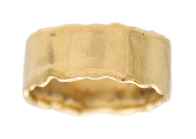 Lot 42 - A 9k gold wide band ring.