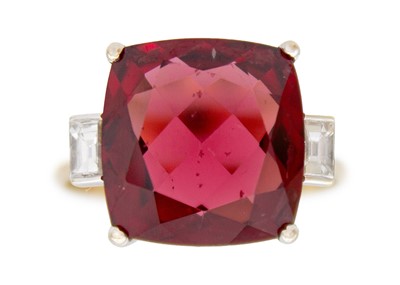 Lot 103 - A Rhodolite garnet and diamond 18k gold dress ring.