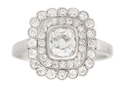 Lot An Art Deco old mine cut diamond cushion ring in platinum.