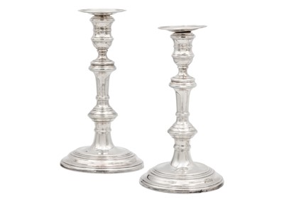 Lot 206 - A pair of silver candlesticks by William Comyns & Sons Ltd.