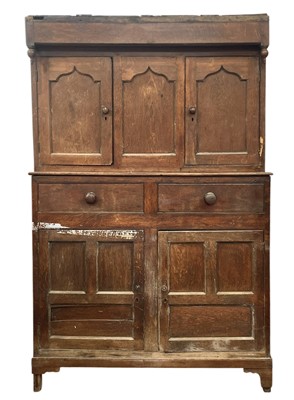 Lot 345 - A George III oak press cupboard.