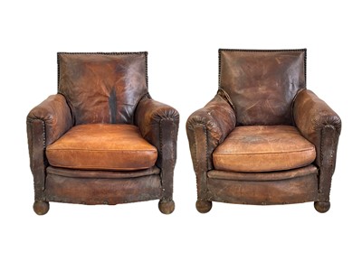 Lot 409 - A pair of leather club armchairs.