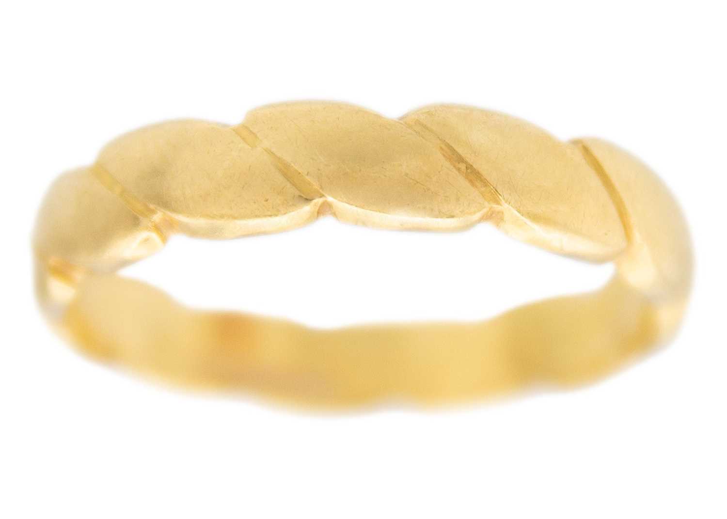 Lot 75 - An 18k band ring of a plaited design.